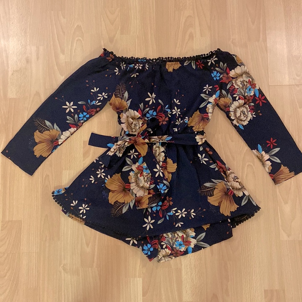 Long sleeve off shoulder floral romper with skirt overlay